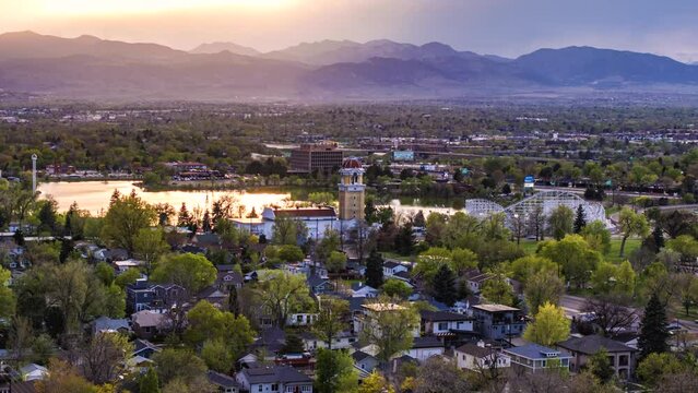 Aerial view of tower and lake at sunset, aerial hyperlapse, Lakewood, Colorado