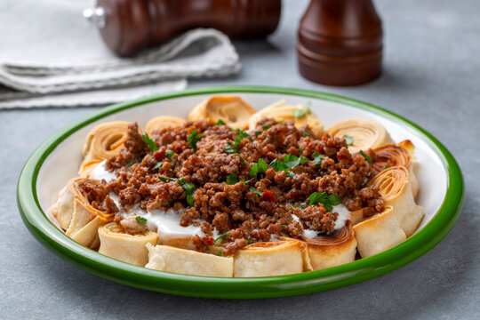 Turkish Manti with Yogurt, Minced Meat and Fried Butter Sauce From Artvin called Silor - Siron - Ziron Rolled Raw Dough and Fried Phyllo -Manlama with Dill
