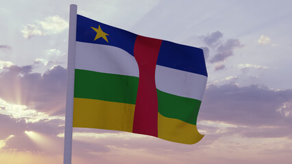 Flag of the Central African Republic in the wind on a sunset sky