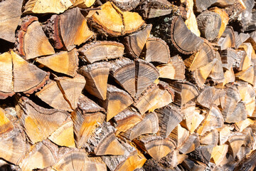 cut and stacked oak firewood, textured firewood background