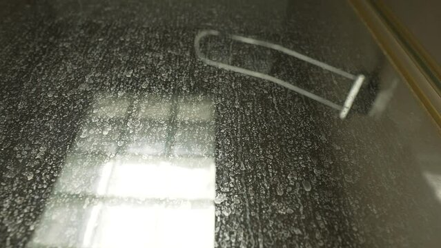 Limescale on the glass door in the shower room