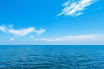 Obraz premium Serene ocean view with blue sky and clouds