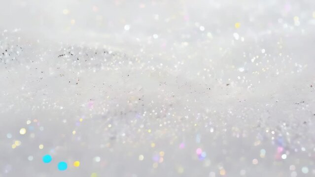 Silver white glitter waves, closeup abstract background, Silky white fabric with glittering sequins, textile luxury design