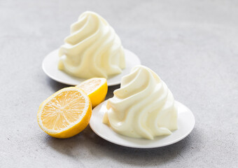 Lemon cream dessert, Panna Cotta in the form of French Chantilly cream. Close-up