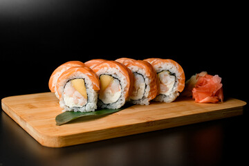 Fusion rolls. fish, shrimp, and mango delight.
