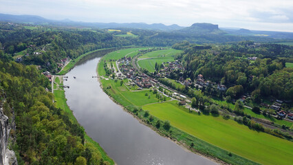 Beautiful summer view of Elbe river from Bastei view pont. Colorful morning scene of Saxon Switzerland national park, Germany, Europe.