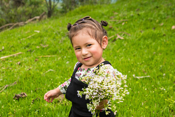 Giving a bouquet of flowers to his mother