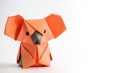 Animal concept origami isolated on white background of a koala bear - Phascolarctos cinereus - with copy space side, simple starter craft for kids