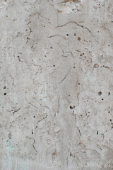 Imagen vertical de una pared con cemento gris ideal para texturas