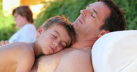 Dad and son together sleeping outdoors