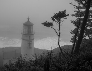 Foggy lighthouse beach scene, Oregon coast