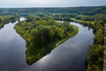 Fototapeta premium Beautiful aerial view of a wooded island on the Neris River in Lithuania