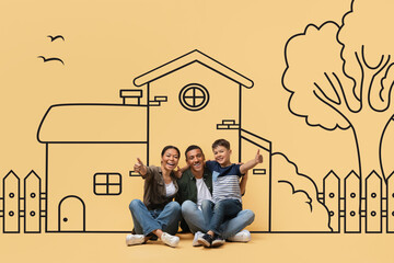 Adorable black family is seated on the ground, facing a life-sized drawing of a house. They appear...