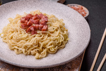 Delicious Asian dish rice noodles or udon with vegetables, spices and herbs
