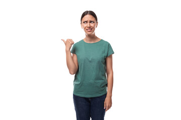 pretty young brunette woman in green t-shirt has doubts and looks away