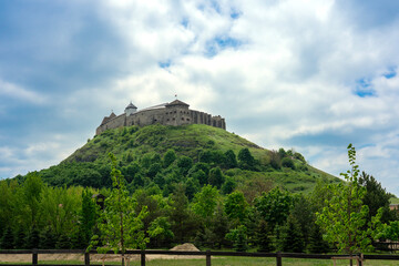 Sumeg castle on the hill in Hungary springtimewith green trees