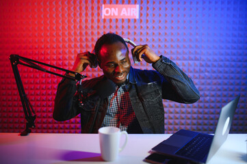 African american video blogger records content in his studio.