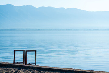Lake side Elegance. Square Metal Handrail Construction. Summertime, vibes. Clear sky.