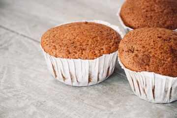 Close up of freshly baked cupcakes on the table.