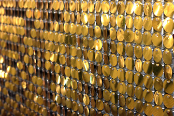 Shiny gold background made of circles. Backdrop rich luxury photo shoot. VIP