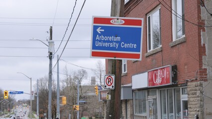 Obraz premium Directions signs in the town of Guelph Ontario - GUELPH, CANADA - APRIL 13, 2024