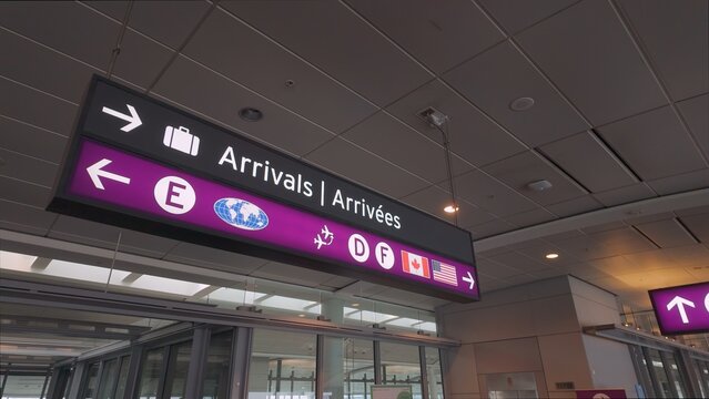 Directions signs at Toronto Pearson International Airport - TORONTO, ONTARIO - APRIL 15, 2024