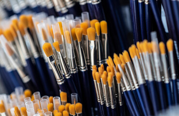 a lot of brushes with artificial bristles for painting in the store
