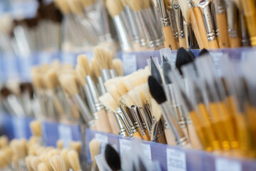 a lot of brushes with artificial bristles for painting in the store
