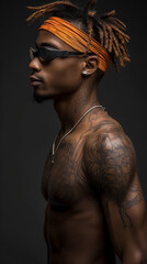 Fototapeta premium A man with distinctive dreadlocks poses confidently, his sunglasses perched atop his head. His cool demeanor radiates style and individuality