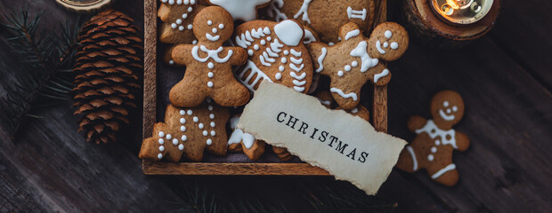 Banner. Wooden box with homemade delicious gingerbread cookies decorated with white icing. Handmade...