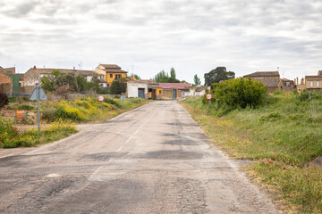 a paved road entering Erla village, comarca of Cinco Villas, province of Zaragoza, Aragon, Spain