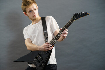 Man playing on electric guitar