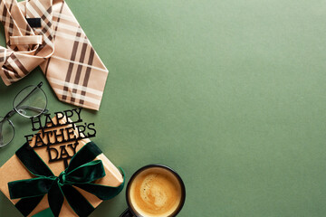 Happy Fathers Day concept. Flat lay composition with necktie, gift box with green ribbon bow,...