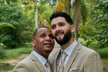 Two guys in formal attire are celebrating their wedding, pride and sexual diversity.