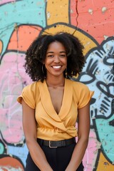 Fototapeta premium Woman Standing in Front of Graffiti Wall