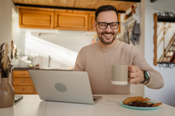 Adult caucasian man prepare to eat breakfast and to work from home