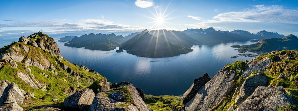 Panorama, view of Fjord Raftsund and mountains in the evening light, sun star, summit of Dronningsvarden or Stortinden, Vesteralen, Norway, Europe