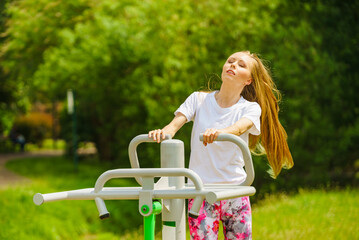 Female doing exercise in outdoor gym