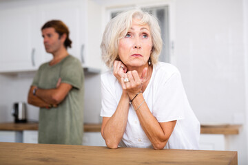 Stressed mature woman dont talking with annoyed man figuring out relations