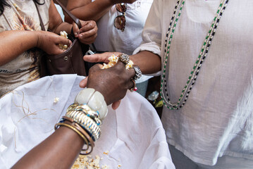 Candomble fans are seen receiving popcorn in honor of Sao Roque in the city of Salvador, Bahia.