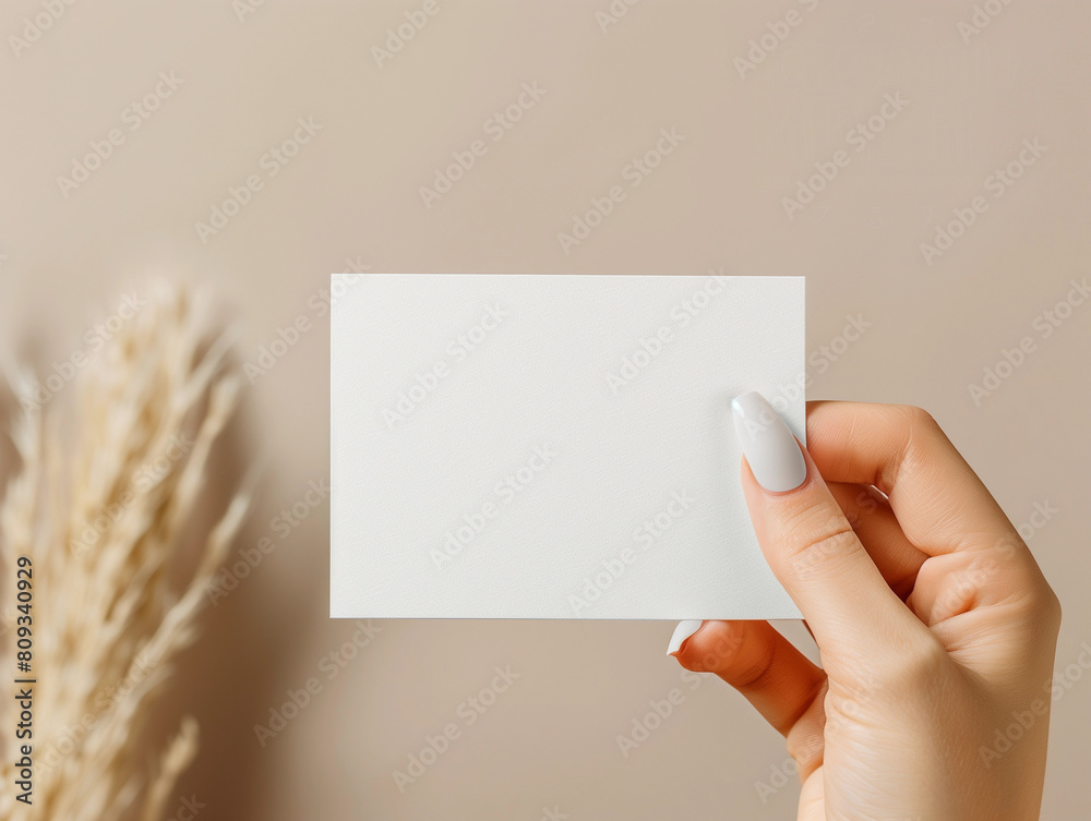 Wall mural Female manicure finger nail hand holding blank white paper mockup brown boho chic for VIP gift voucher business card promo mock up natural simple template brand minimalistic farmhouse empty design