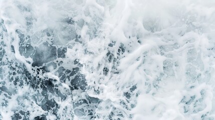 Naklejka premium Captivating aerial shot of chaotic sea foam patterns, showcasing the intense power of the ocean during a tumultuous swell, perfect for dynamic backgrounds or nature-themed designs
