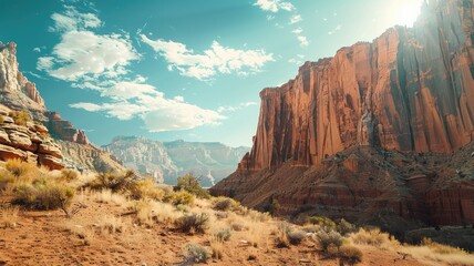 Sunlit red rock canyon under blue sky