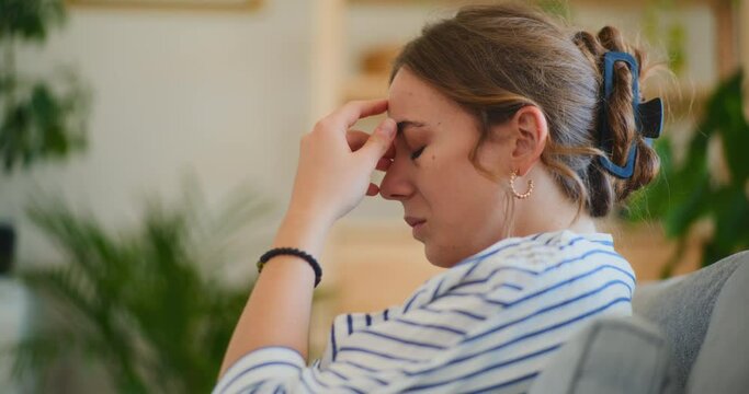 Upset Businesswoman Contemplating on Sofa