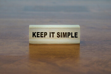 KEEP IT SIMPLE word on a wooden block.