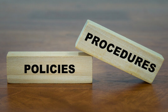 Policies and Procedures word on wooden block.