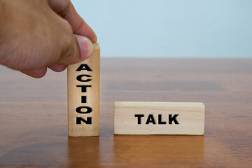 Action versus Talk on wooden blocks.