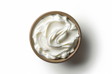 a bowl of whipped cream on a white surface