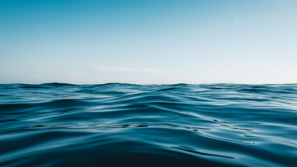 Obraz premium Peaceful Sea Water Under Blue Sky with Copy-Space