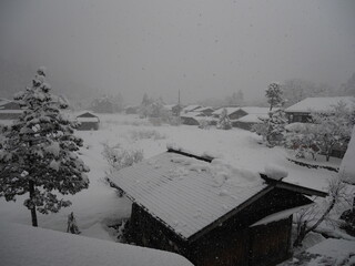 Bad weather and heavy snow in the mountains. Mountain village in winter. Macugnaga, main square, Italy, an important ski resort at the foot of Monte Rosa in the europeans Alps